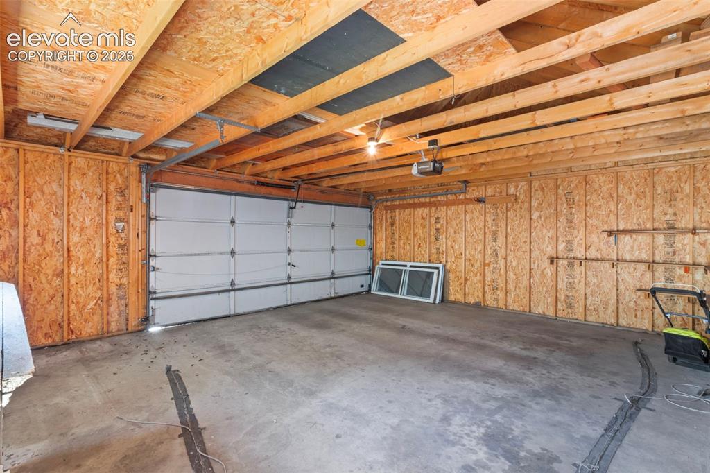 Image 31 of 31: Over-sized two car garage.