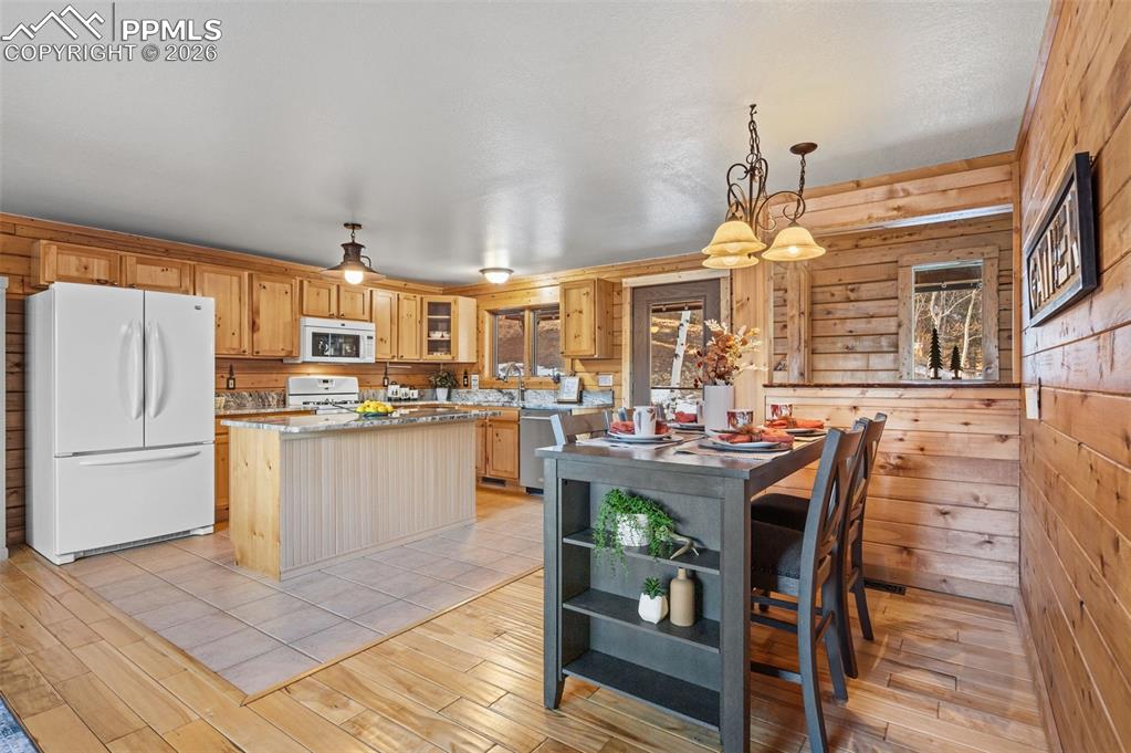 Image 10 of 41: Main level kitchen and dining area