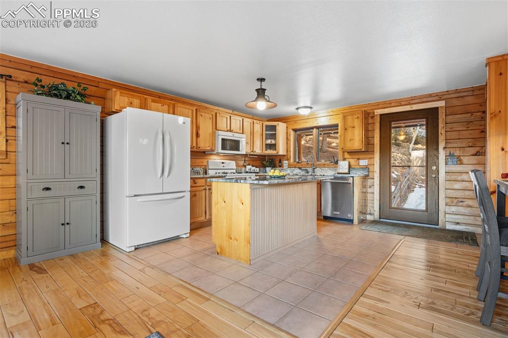 Image 12 of 41: Main level open concept kitchen and dining area 