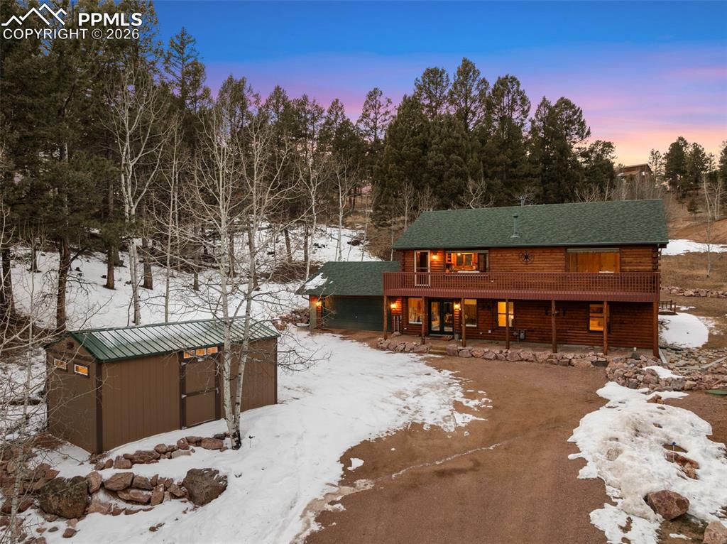 Image 2 of 41: Front of home with shed