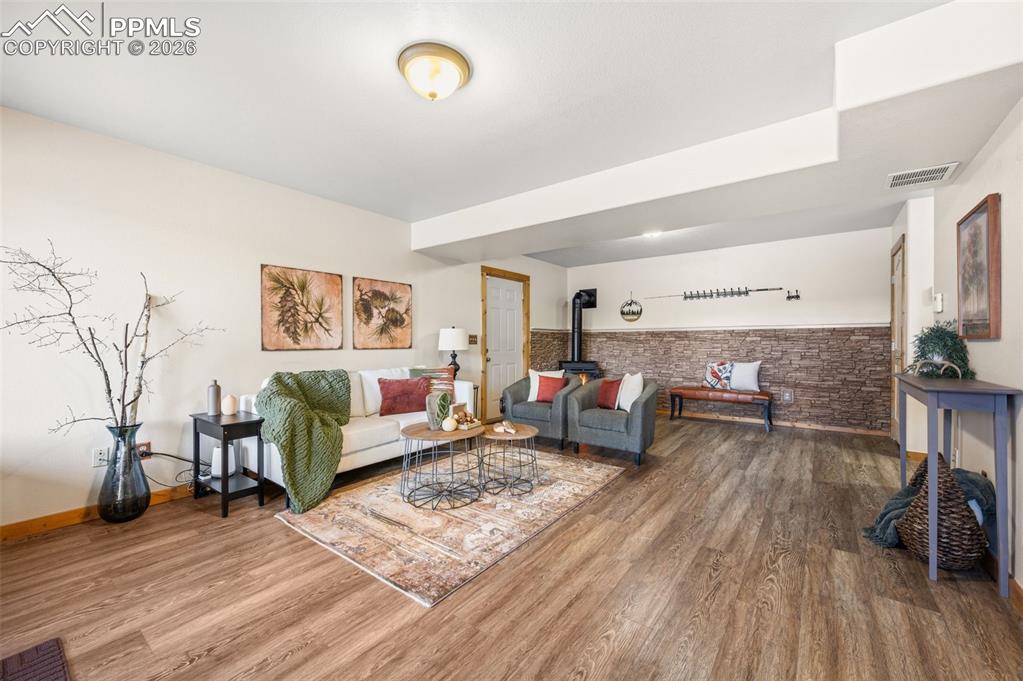 Image 22 of 41: Basement family room walk out and access to garage