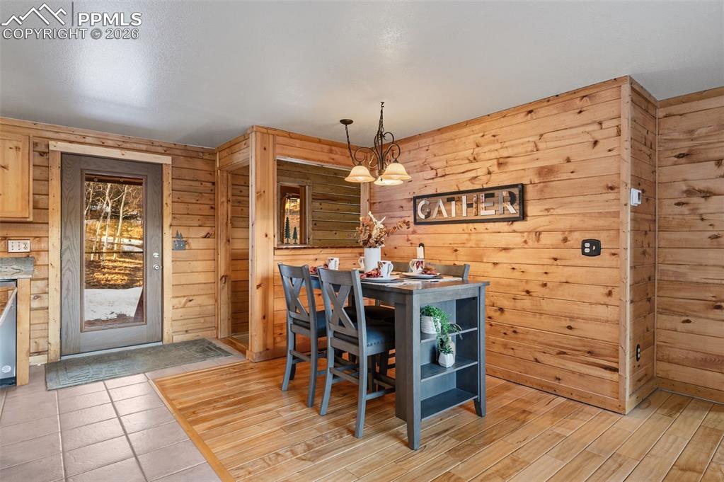 Image 9 of 41: Main level dining area with walk out to covered deck