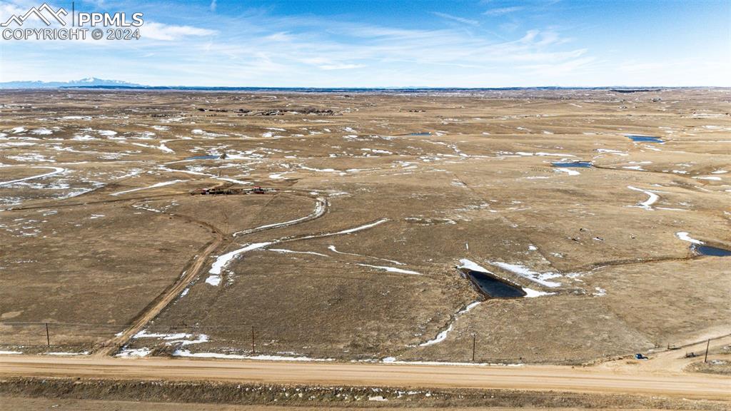 Image 6 of 20: Birds eye view of property with a rural view