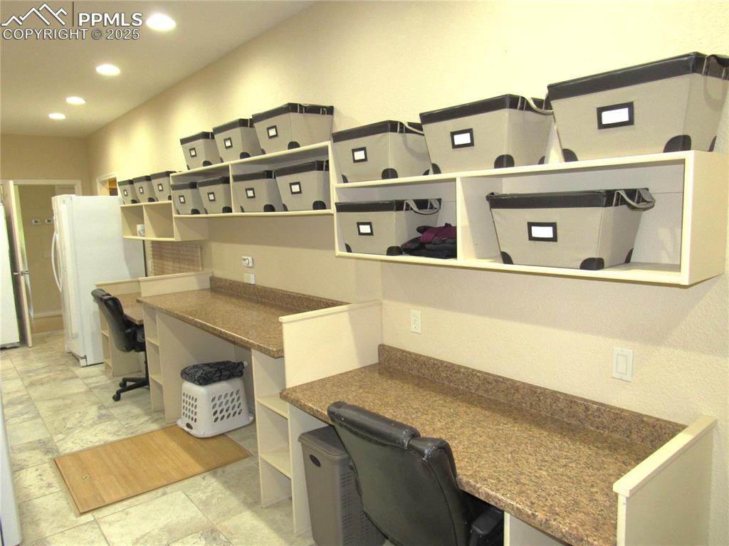 Image 30 of 45: Craft side of Laundry/Craft Room