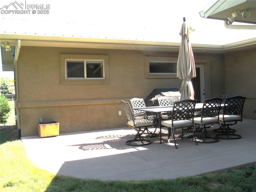 Image 35 of 45: Rear Patio.  Accessible from two areas of the home