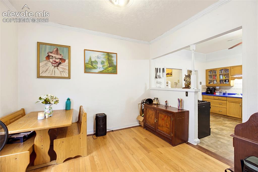 Image 14 of 26: Hardwood flooring throughout the dining area