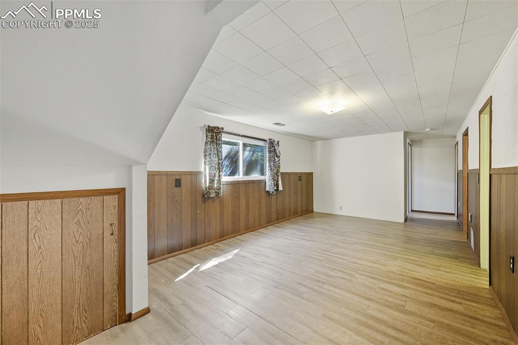 Image 12 of 29: Lower family room featuring new LVP floors