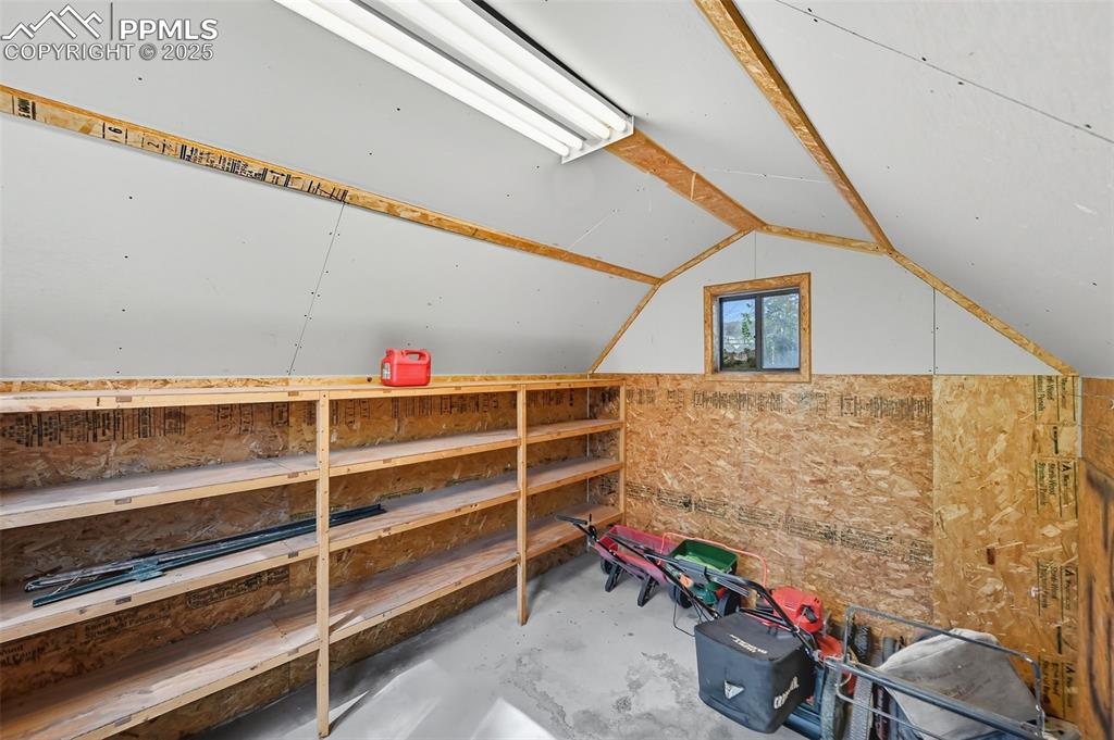 Image 22 of 29: View of inside shed featuring electric outlets and lighting