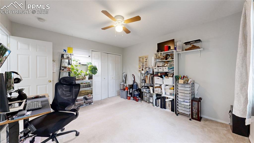 Image 15 of 37: Home office featuring a ceiling fan and carpet