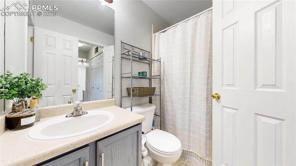 Image 16 of 37: Full bathroom featuring vanity and curtained shower