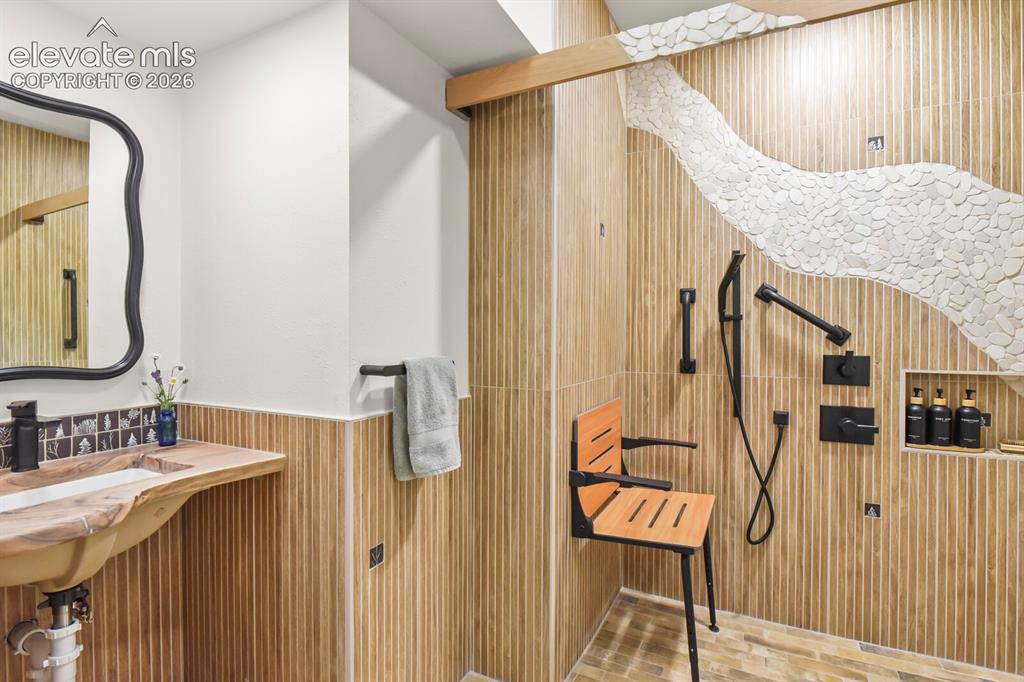 Image 34 of 50: Beautifully done 3/4 bathroom that was just remodeled and is wheelchair acc