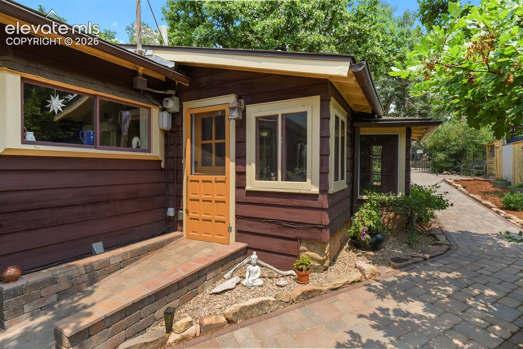 Image 8 of 50: Front door with paved ramp entrance
