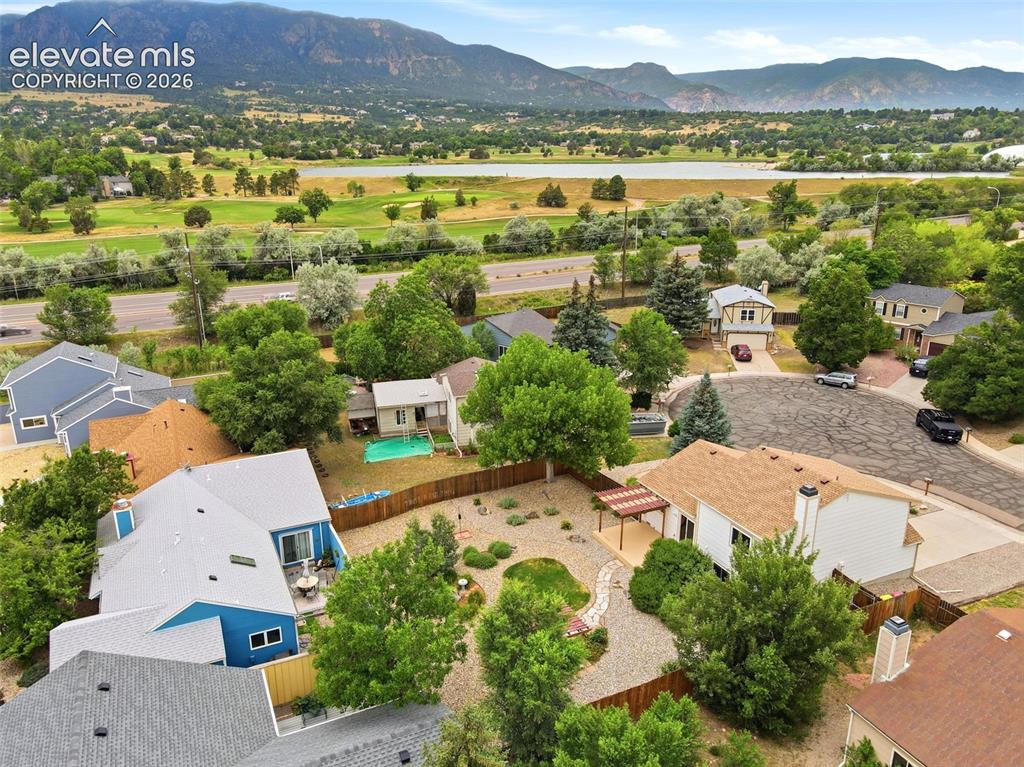 Image 47 of 50: Aerial overview showcasing residential properties nestled within a landscap