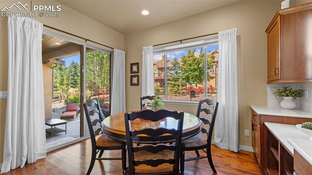 Image 18 of 48: Breakfast nook with sliding doors to start your mornings right.