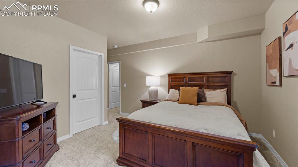 Image 33 of 48: Guest bedroom that could also moonlight as your personal yoga retreat.