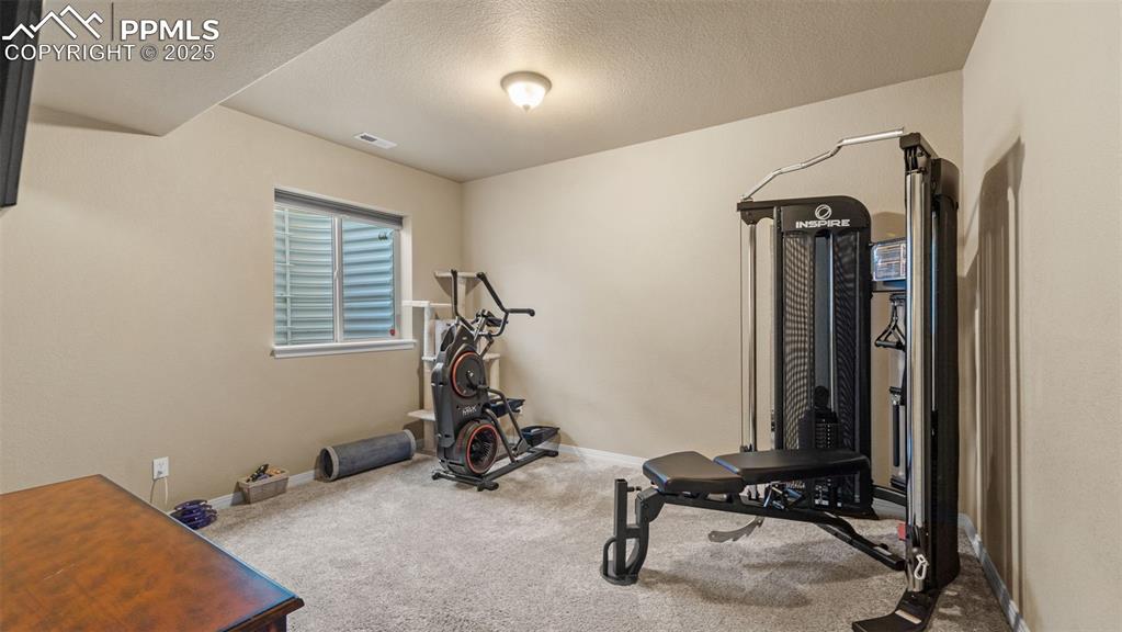 Image 36 of 48: Home gym corner, perfect for crushing workouts or just pretending you use t