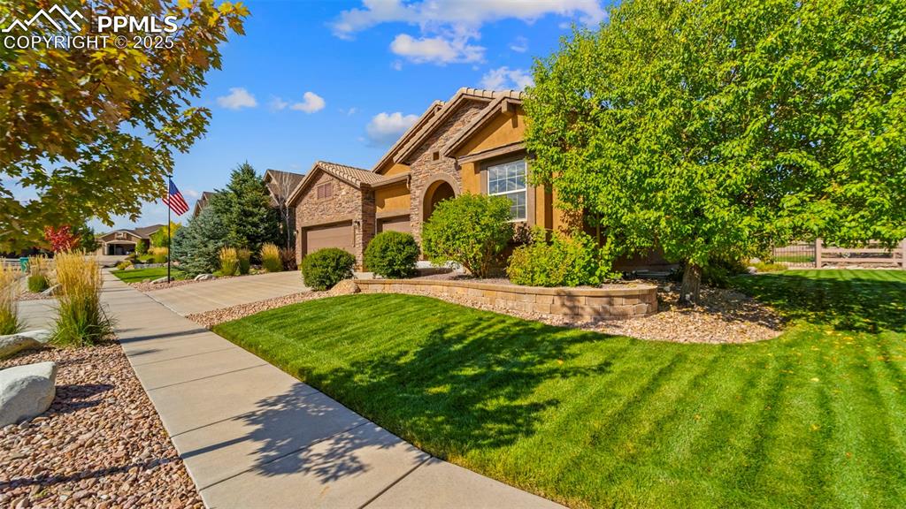 Image 4 of 48: Front detail shot: even the driveway looks like it belongs in a brochure.