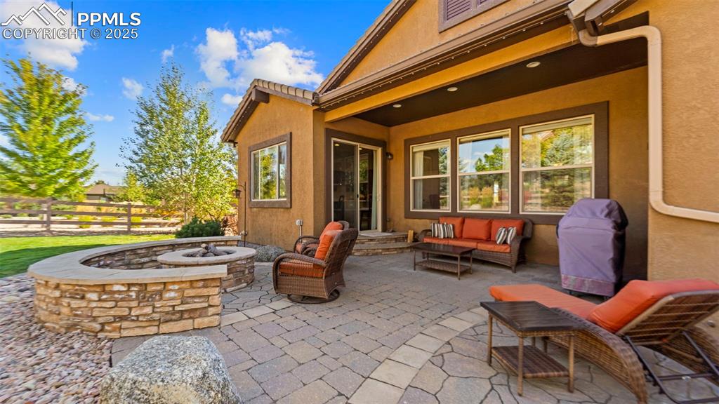 Image 40 of 48: Patio that says, “bring on the summer nights and s’mores.”