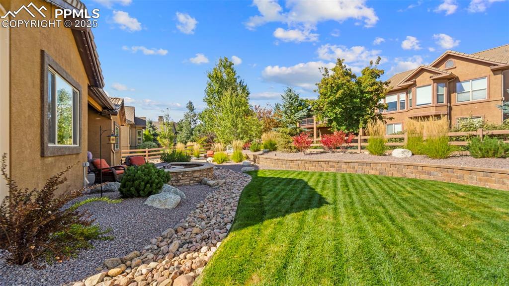 Image 41 of 48: Backyard lawn where dogs, kids, and frisbees all find happiness.
