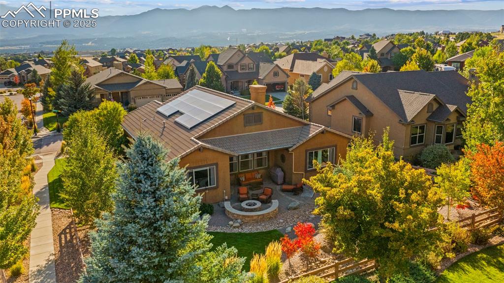 Image 42 of 48: High-flying view of the property and beyond, you can practically hear the d