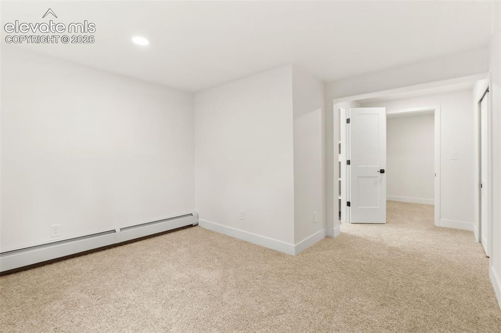 Image 33 of 43: Unfurnished room featuring light colored carpet, recessed lighting, and a b