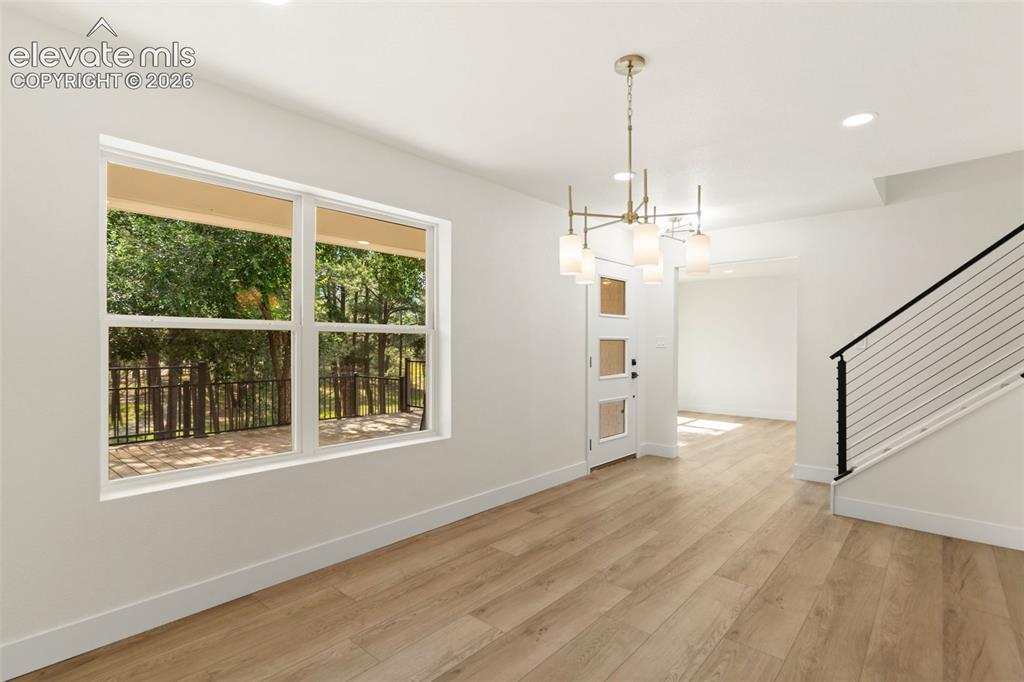 Image 6 of 43: Unfurnished dining area featuring recessed lighting, light wood-type floori