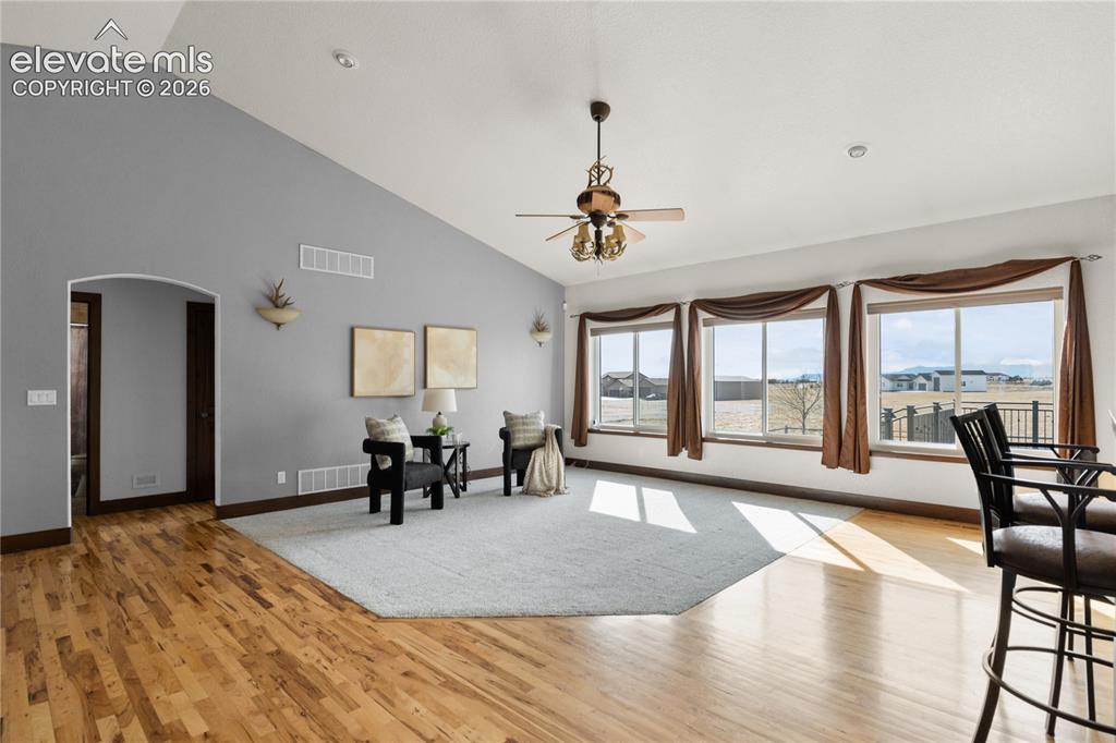 Image 11 of 40: This living room has peak views, privacy on your acreage and a multi-sided