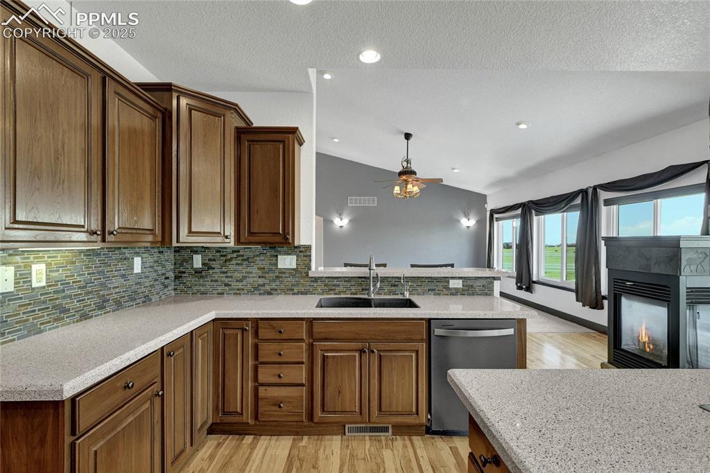 Image 14 of 40: Stainless appliances, stone countertops, and so much natural light and priv