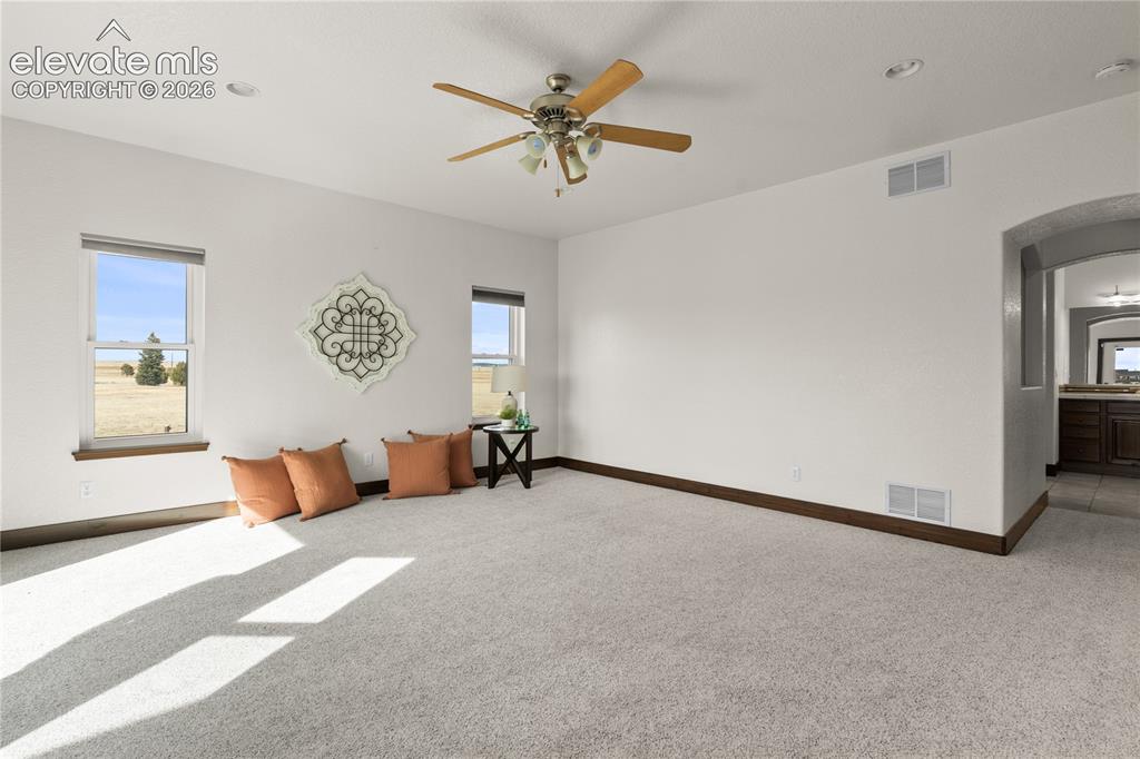 Image 21 of 40: The primary suite on the main level makes this home TRUE main level living