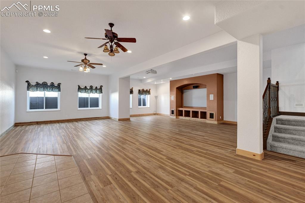Image 29 of 40: The basement has soaring ceilings and plenty of room for games, a theatre,