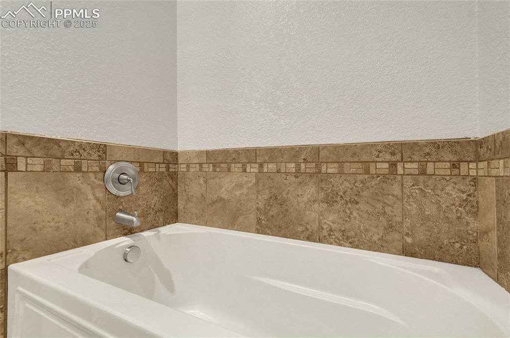 Image 36 of 40: Lower level full bathroom.