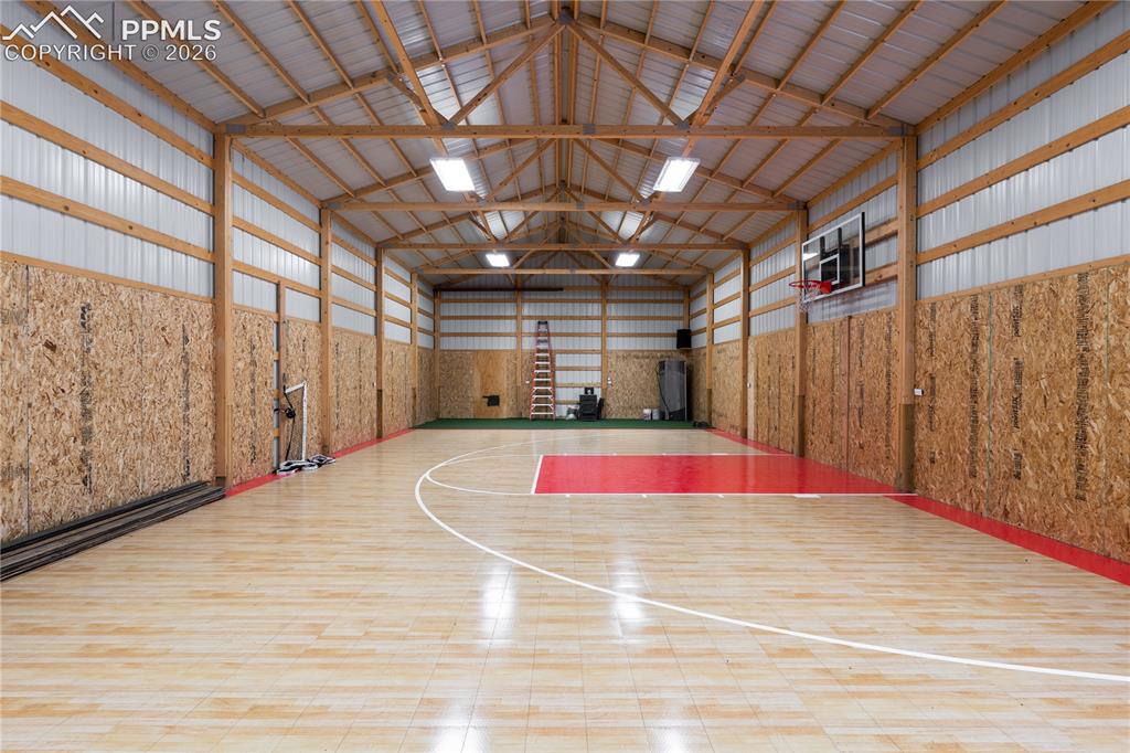 Image 6 of 40: A second building has a huge sport court, pickle ball net, and more. Imagi