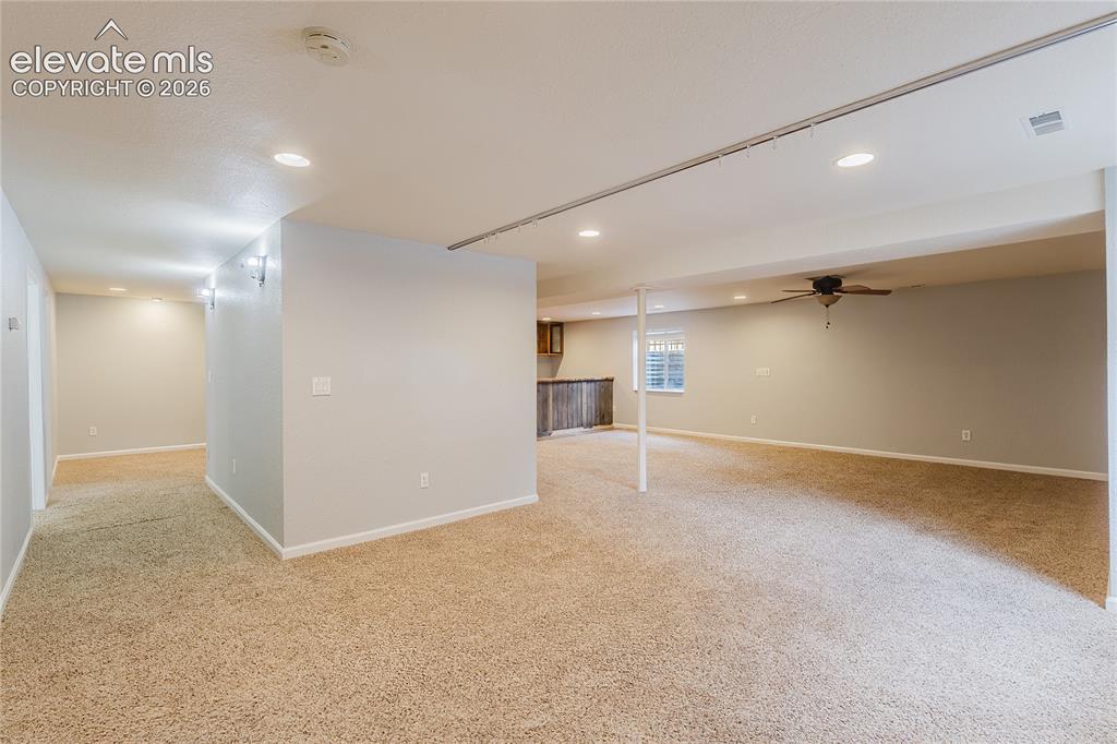 Image 14 of 46: Recessed lighting and ceiling-mounted fan