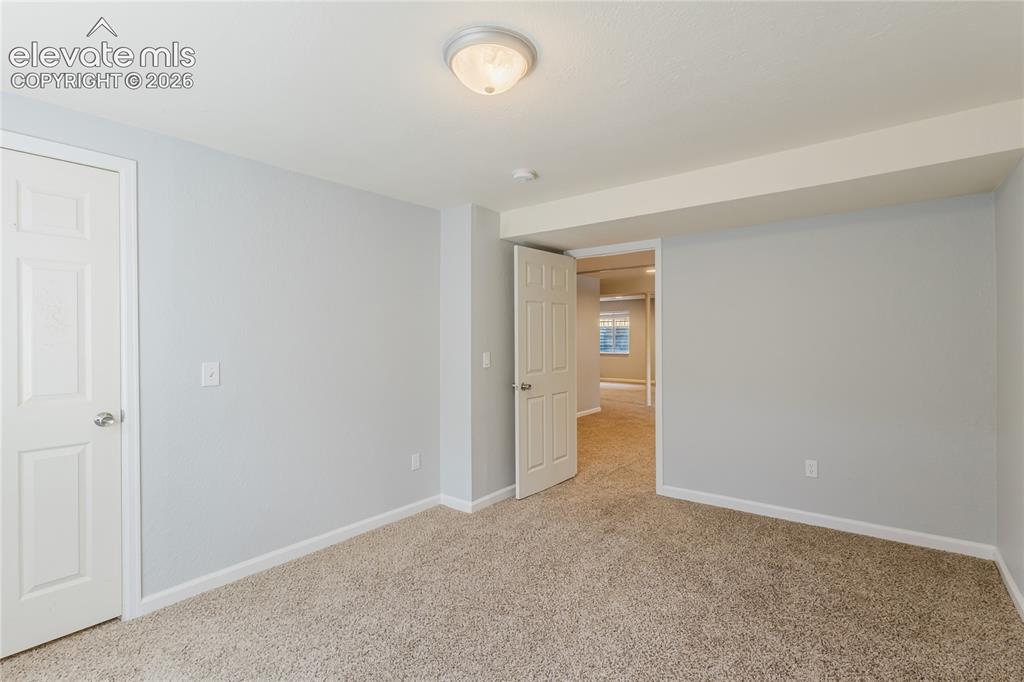 Image 18 of 46: Basement bedroom.