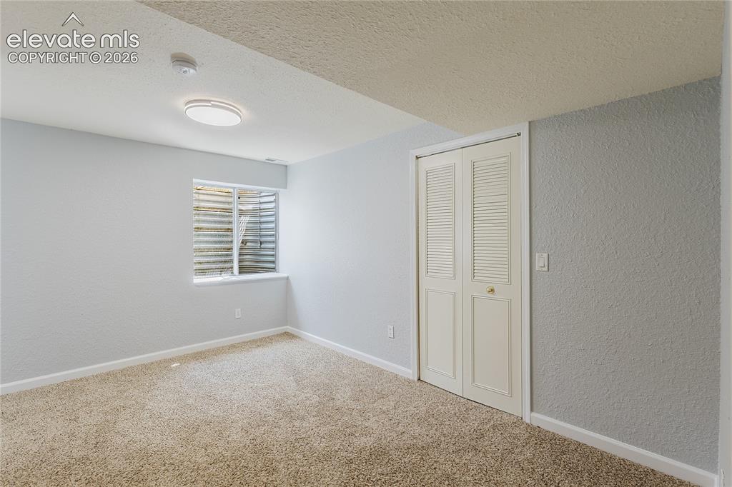 Image 7 of 46: Basement bedroom