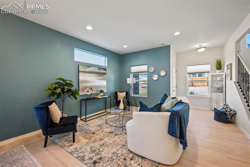 Image 6 of 22: OPEN MAIN LEVEL WITH BEAUTIFUL LVP FLOORING