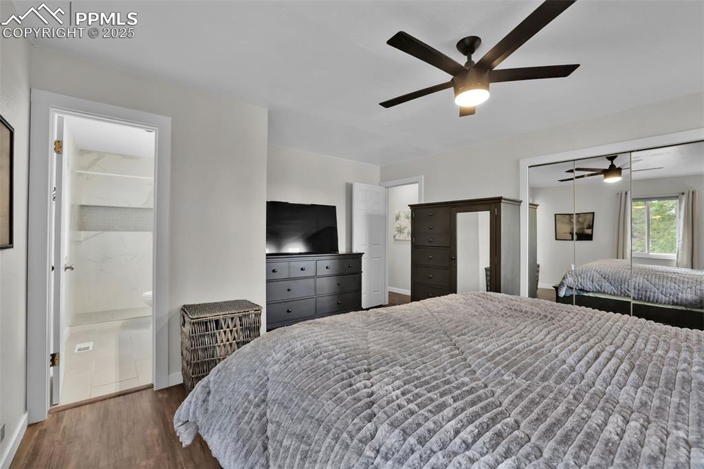 Image 25 of 50: Bedroom featuring dark wood-style flooring, a closet, ceiling fan, and conn