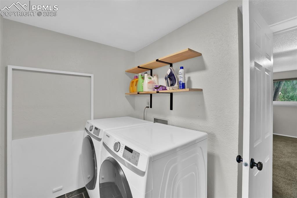 Image 39 of 50: Washroom with independent washer and dryer