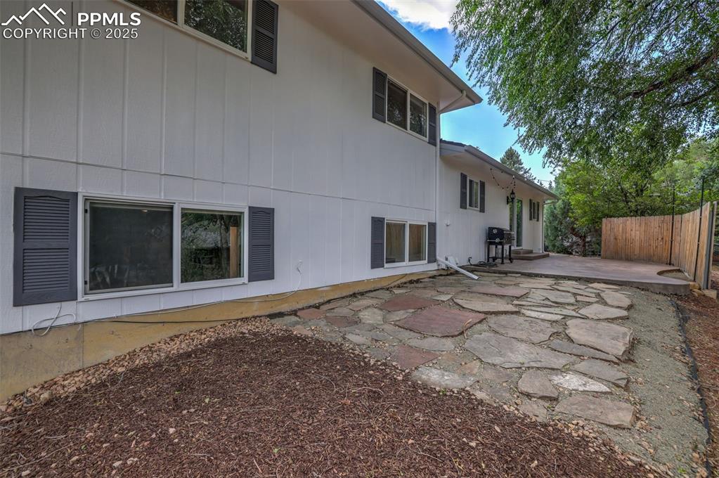 Image 44 of 50: Rear view of house with a patio area
