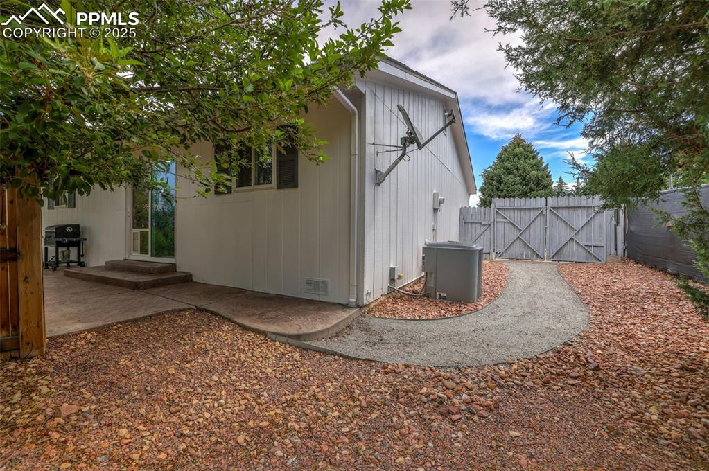 Image 45 of 50: View of outbuilding featuring a gate
