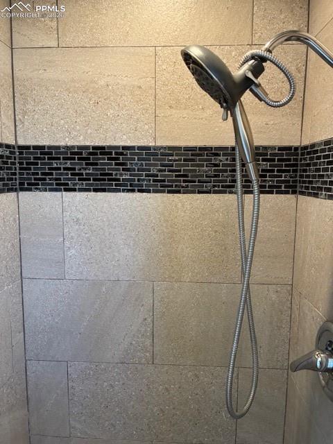 Image 12 of 36: Bathroom view of tiled shower