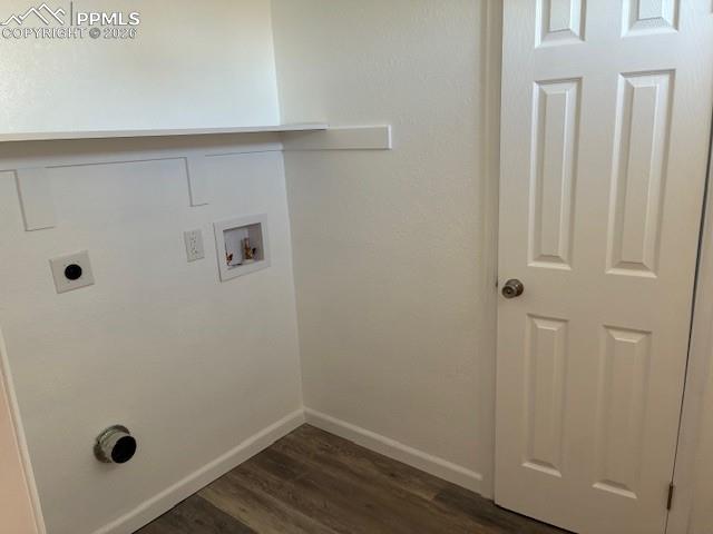 Image 25 of 36: Laundry room featuring a textured wall, dark wood-style flooring, hookup fo
