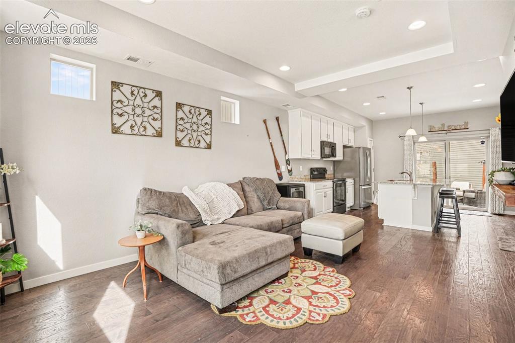 Image 7 of 21: Main Level Living - Dining - Kitchen Area - With WONDERFUL WALK OUT PATIO!