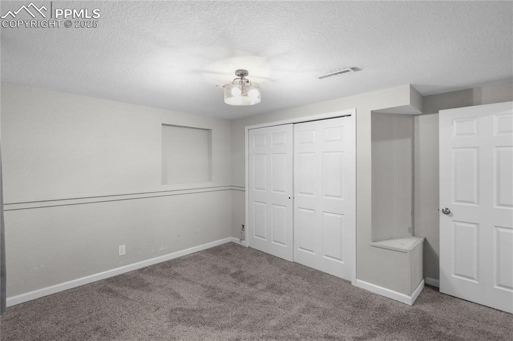 Image 34 of 38: Bedroom