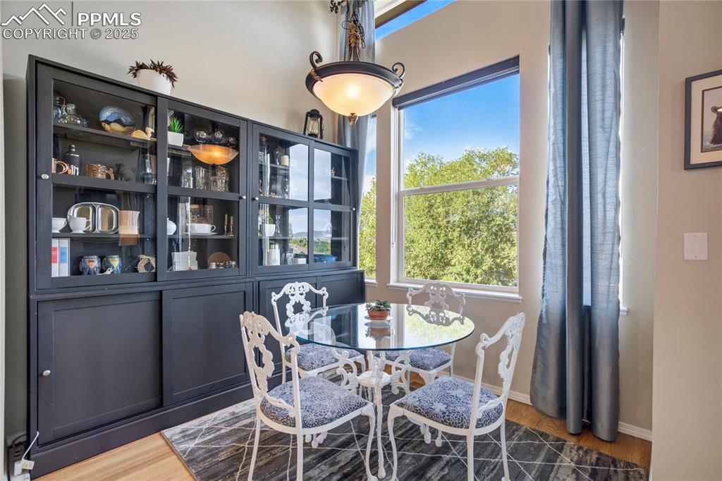 Image 11 of 43: Dining space featuring wood finished floors