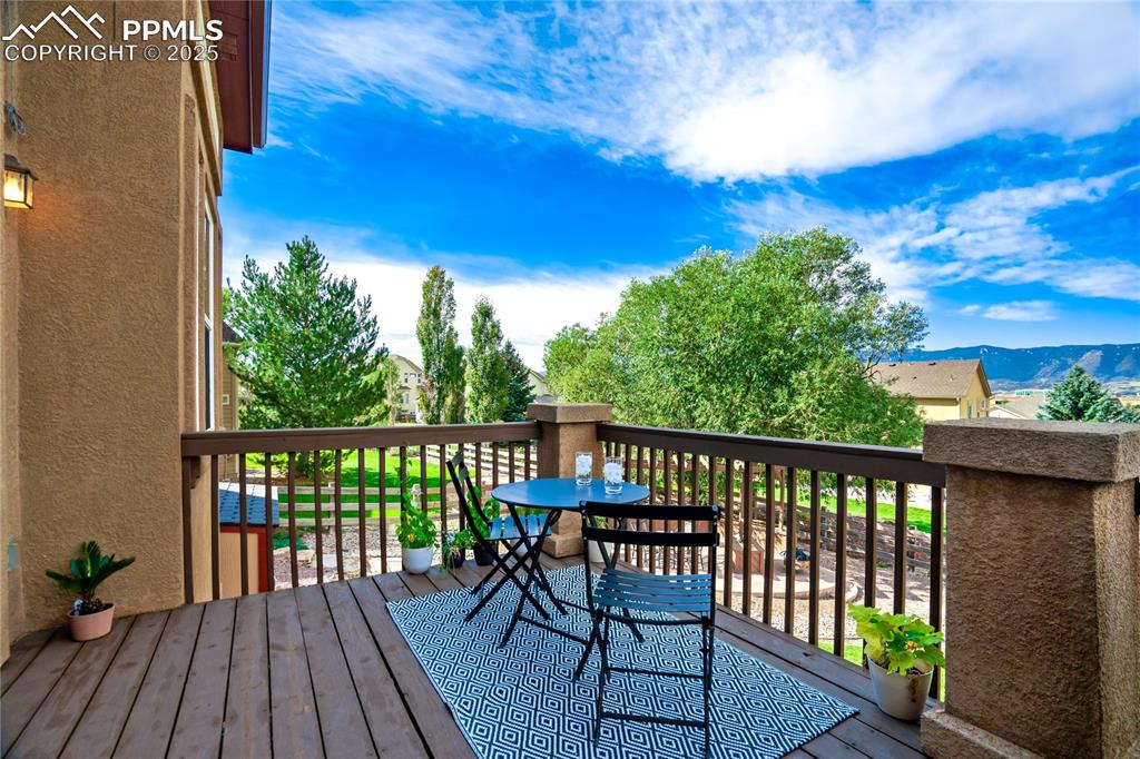 Image 12 of 43: Wooden deck featuring a mountain view