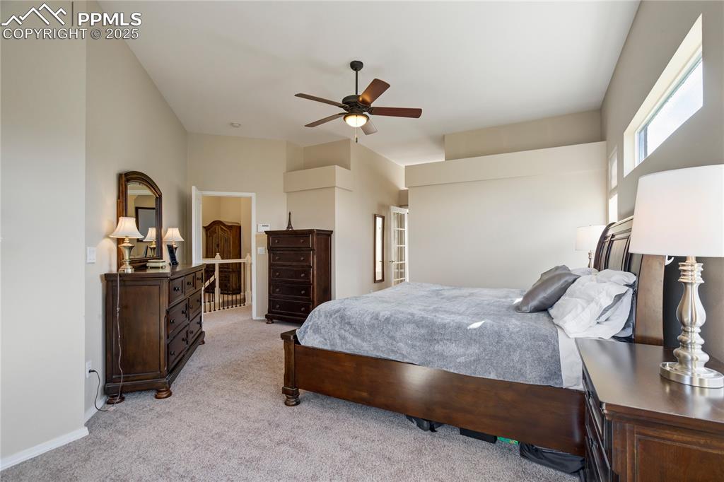 Image 19 of 43: Bedroom featuring light carpet and ceiling fan