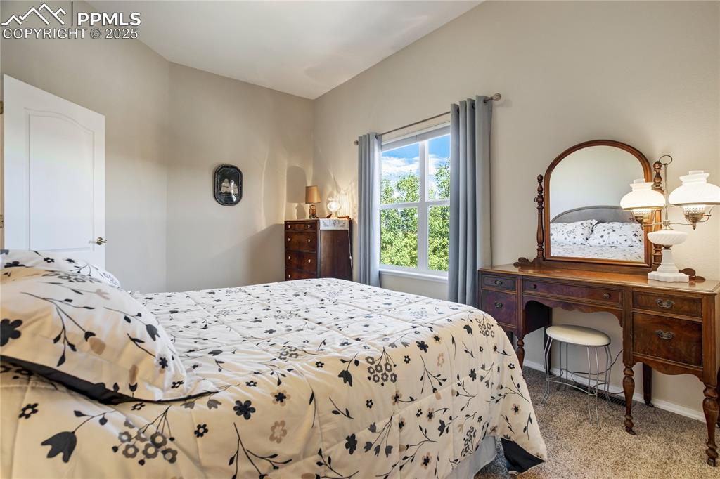 Image 23 of 43: Bedroom with carpet flooring and baseboards