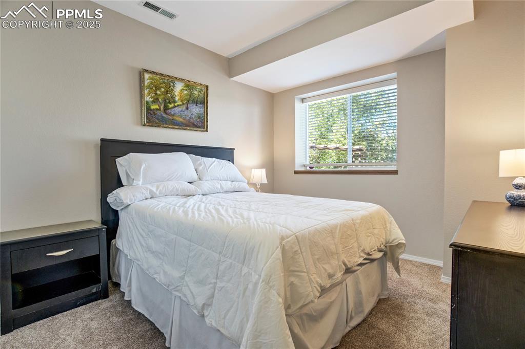 Image 30 of 43: Carpeted bedroom with baseboards