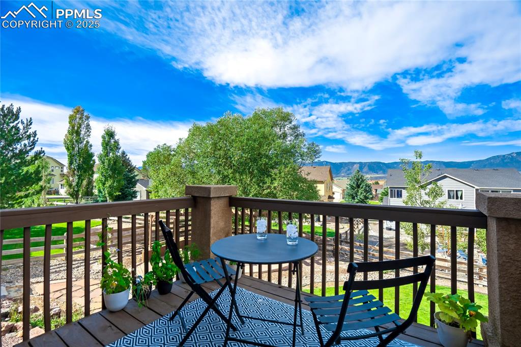 Image 36 of 43: Wooden deck with a residential view and a mountain view
